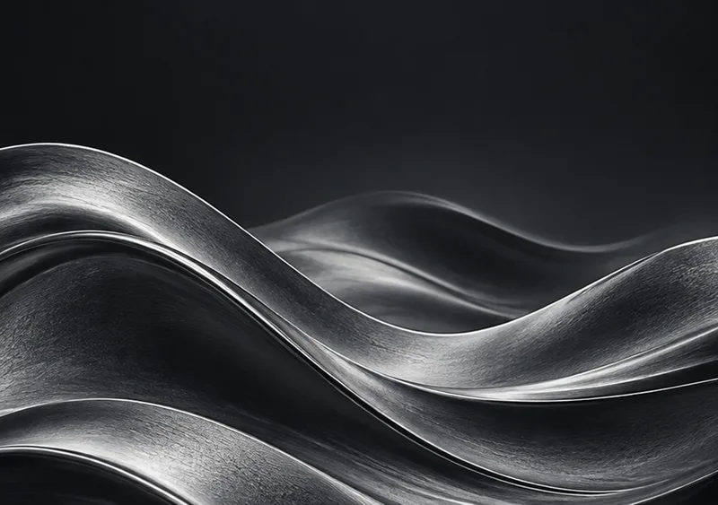 Layered graphite waves leave a calm charcoal sky above. — Inner Display