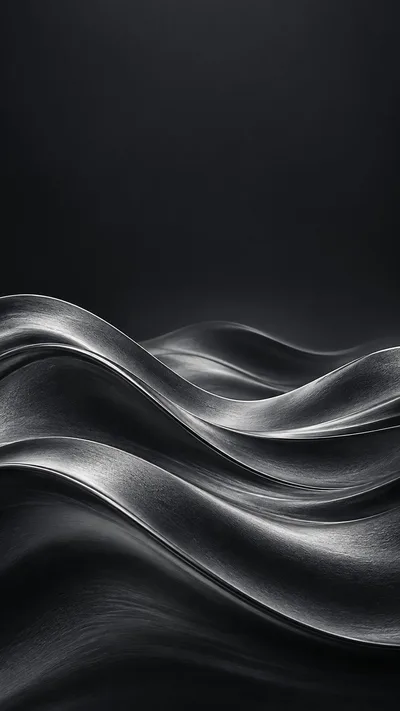 Layered graphite waves leave a calm charcoal sky above.